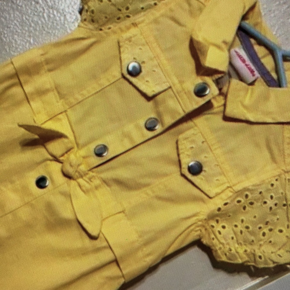 Classic style design features vibrant floral blouse